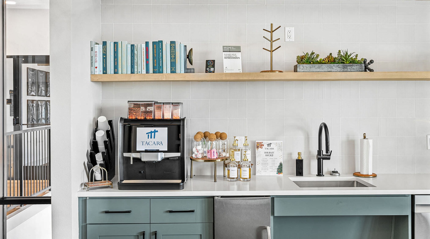 a kitchen with a microwave oven and shelves
