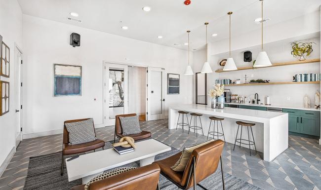 a room with a table chairs and a large chandelier
