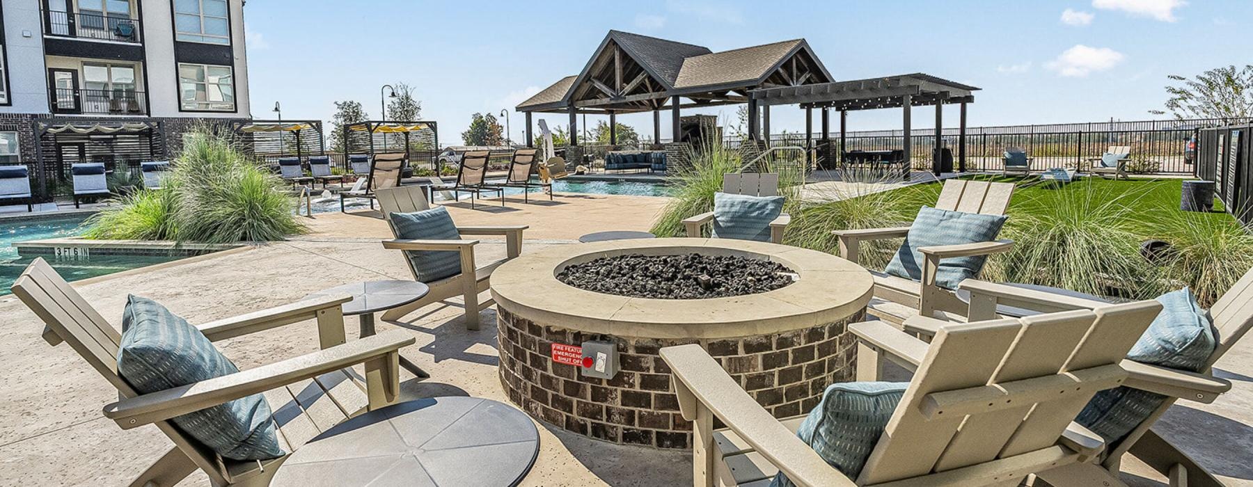 a patio with chairs and tables