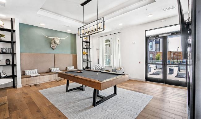 a room with a table and shelves