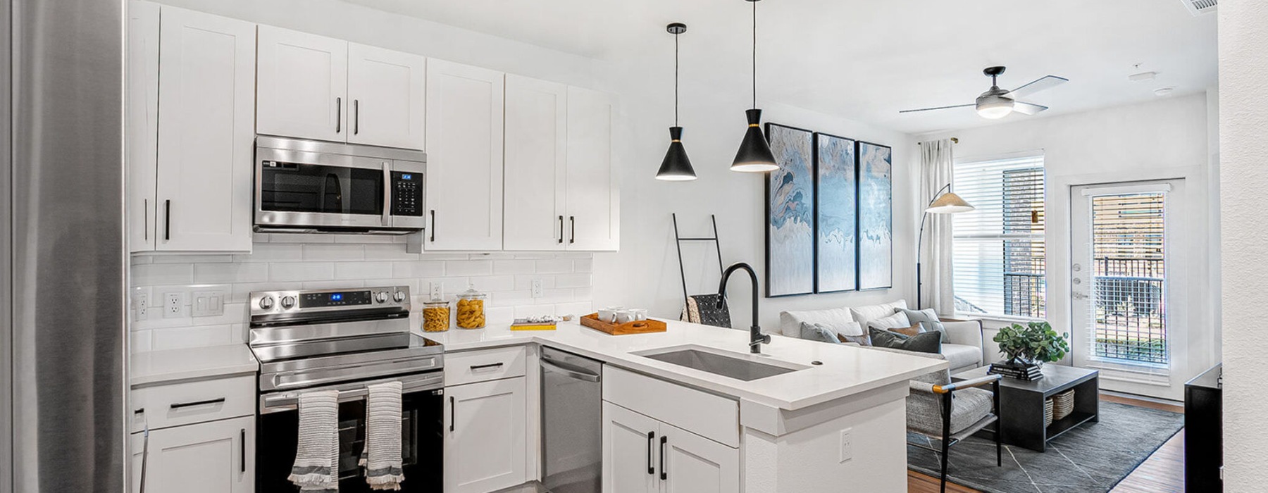 a kitchen with white cabinets