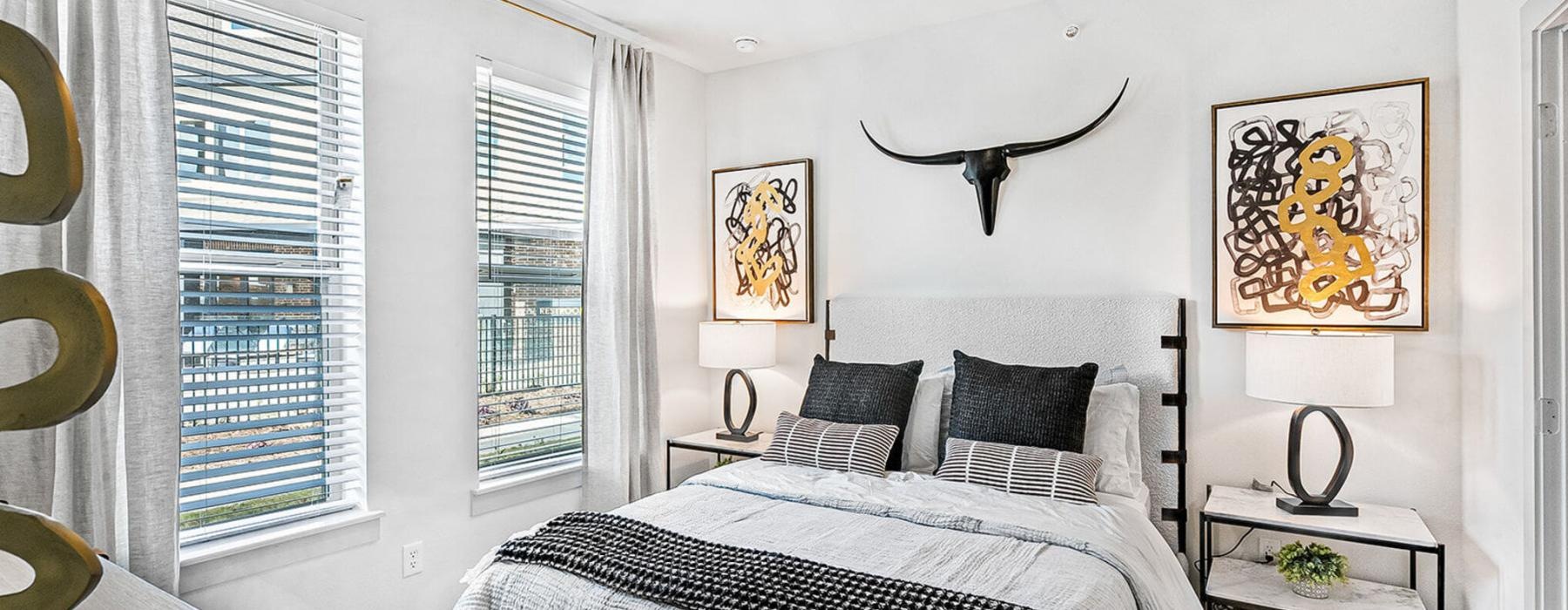 a bedroom with a bed and a fan